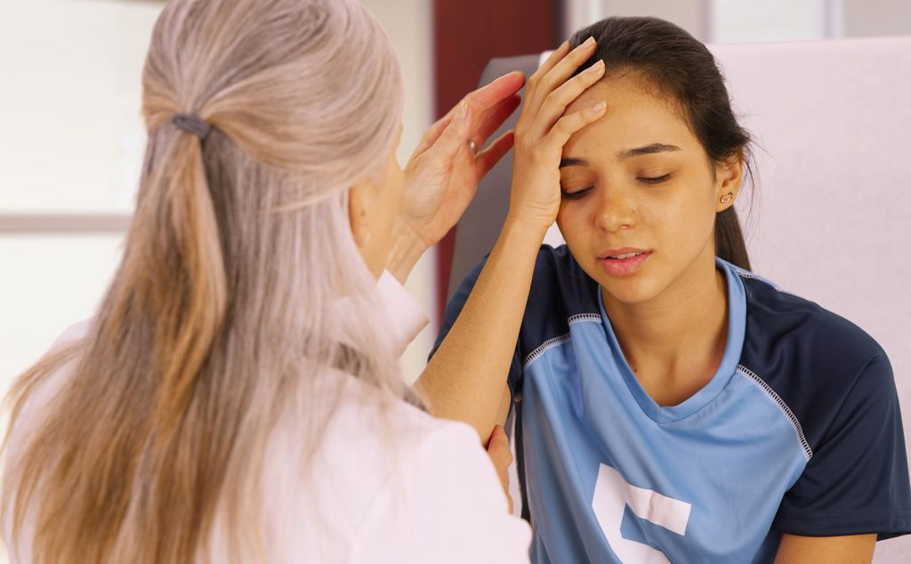Woman with concussion visiting occupational therapist