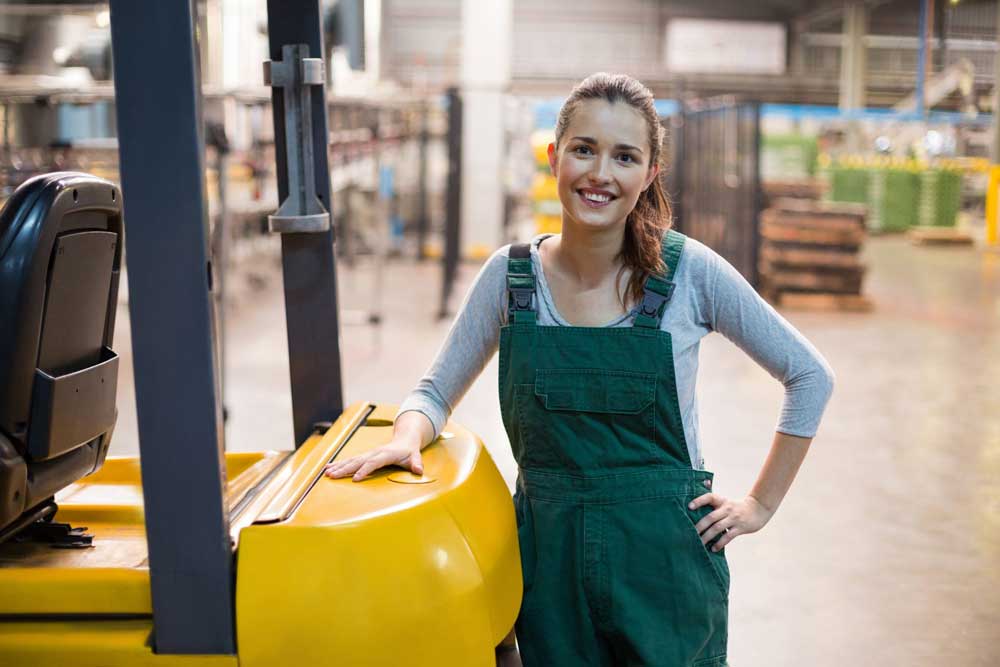 Smiling happy female warehouse employee after work conditioning