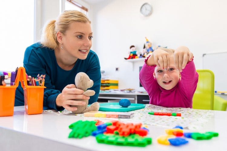 Child playing with pediatric occupational therapist