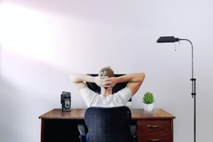 7 Ergonomic Tips: Man sitting in a chair